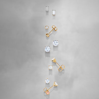 Looking for stylish stud earrings that will add a touch of elegance to your wardrobe? Check out our gold and silver earrings featuring dazzling diamonds and beautiful gemstones. We also offer trendy metal fashion earrings
