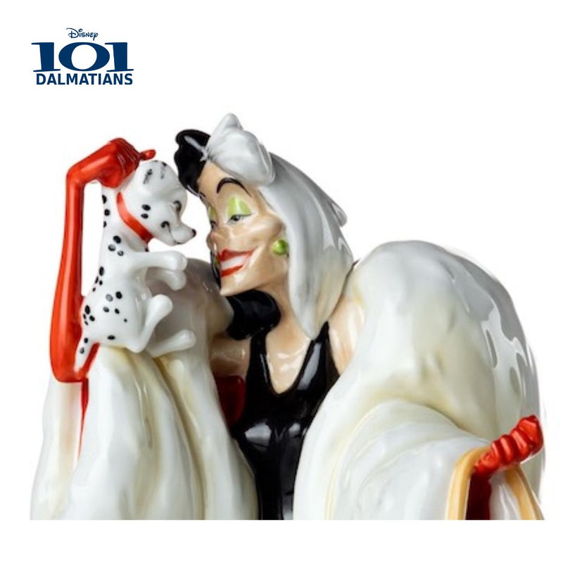Introducing the Disney Villain - Cruella de Vil from 101 Dalmatians Limited Edition Figurine for all the fans out there! This striking figure of Cruella de Vil shows the evil villain holding a growling pup in her bony hand. With intricate details and hand-painted accents, this figurine is handmade and decorated in fine bone china. Available at Jewels of St Leon.