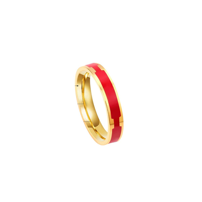 A striking 18K gold-plated stainless steel stackable band with vibrant red enamel detailing. A modern and stylish unisex ring.