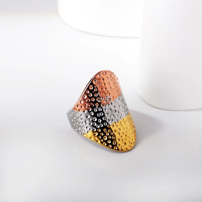 A striking 18K gold-plated stainless steel vintage-inspired wide band ring, featuring a beautiful fusion of Yellow Gold, Rose Gold, and Silver tones. A true statement piece that exudes elegance and sophistication.
