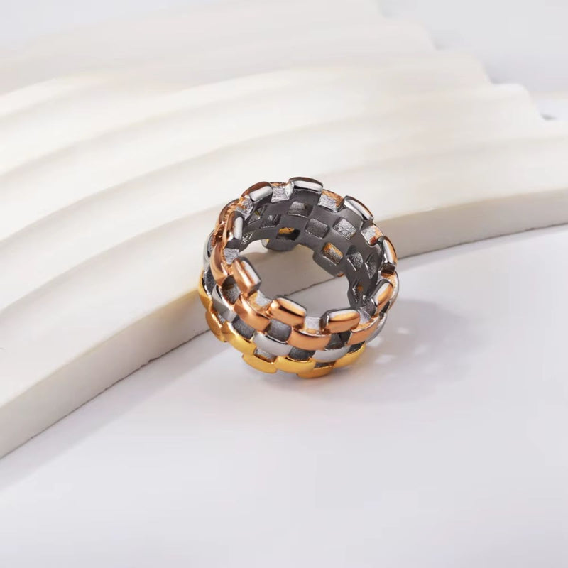 A bold 18K gold-plated stainless steel chain-style ring featuring a mix of Yellow Gold, Rose Gold, and Silver hues. The chunky 13mm width enhances its industrial-modern appeal.