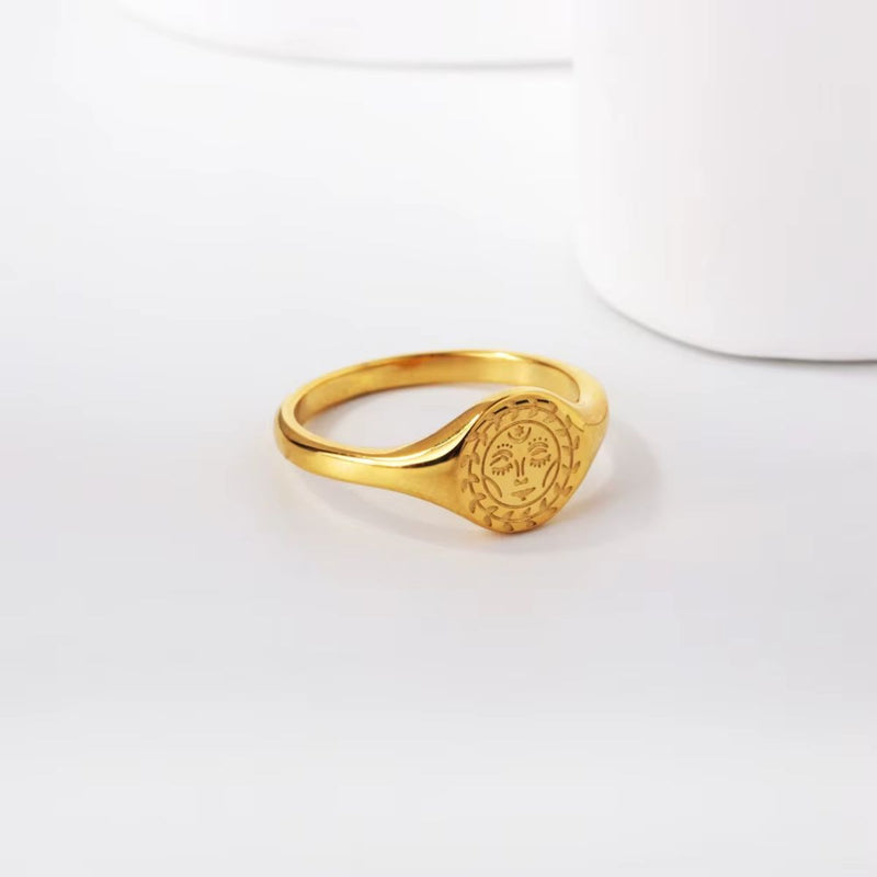 A celestial-inspired statement piece. The Celestial Sun Ring - A beautifully detailed 18K gold-plated stainless steel ring featuring a radiant sun motif.