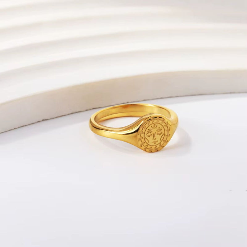 Celestial Sun Ring - A beautifully detailed 18K gold-plated stainless steel ring featuring a radiant sun motif. A celestial-inspired statement piece.
