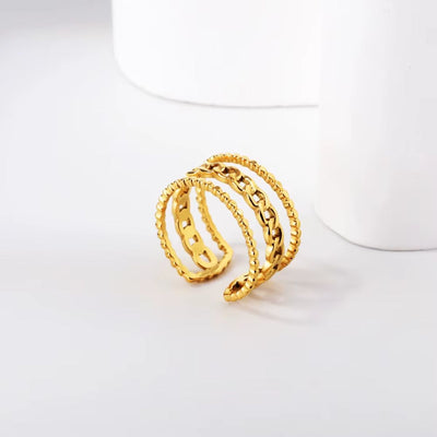 A stylish 18K gold-plated stainless steel ring featuring beaded outer bands and a chain link centre.