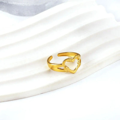 A delicate open-heart ring - symbolic, stylish, and effortlessly charming. This delicate yet striking design is crafted from durable 18K gold-plated stainless steel, offering a polished finish and lightweight feel.