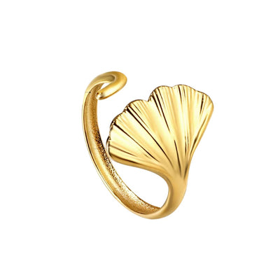 A delicate ocean-inspired ring - lightweight, adjustable, and elegant. 18K gold-plated stainless steel open shell ring with a modern organic shape.
