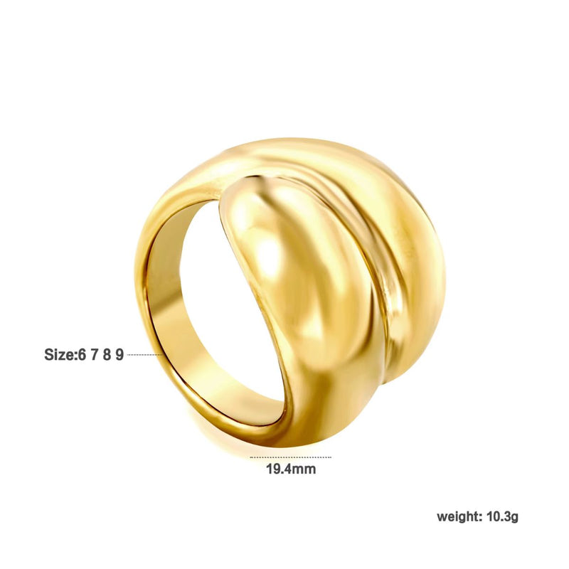 A wide 18K gold-plated stainless steel wrap-around ring with a sleek, polished finish. A modern chunky piece of high quality fashion jewellery.