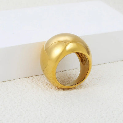 The bold 22mm width creates a statement piece that exudes elegance and confidence. A luxurious 18K gold-plated stainless steel dome ring with a high-shine, smooth surface.