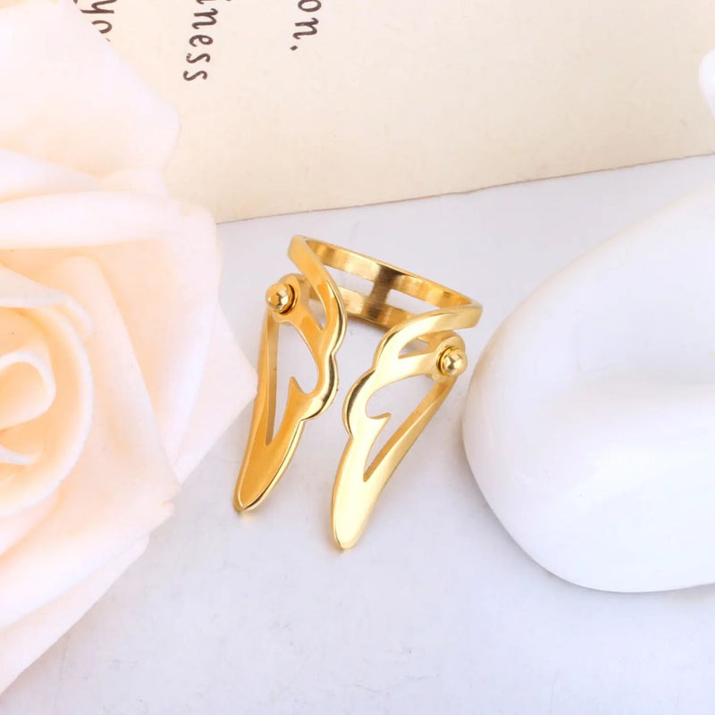Inspired by celestial beauty, this Fashion Wing Shaped Ring features an elegant and intricate wing design measuring 28x20mm overall. A stunning 18K gold-plated stainless steel wing-shaped ring.