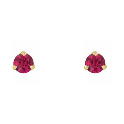 Behold the allure of our 3.0mm natural ruby earring studs in a three prong setting, expertly fashioned from 14kt yellow gold. The front-facing image highlights the radiant splendour of the medium dark red natural rubies, making a captivating statement. Shop ruby earrings for women in Australia from Jewels of St Leon.