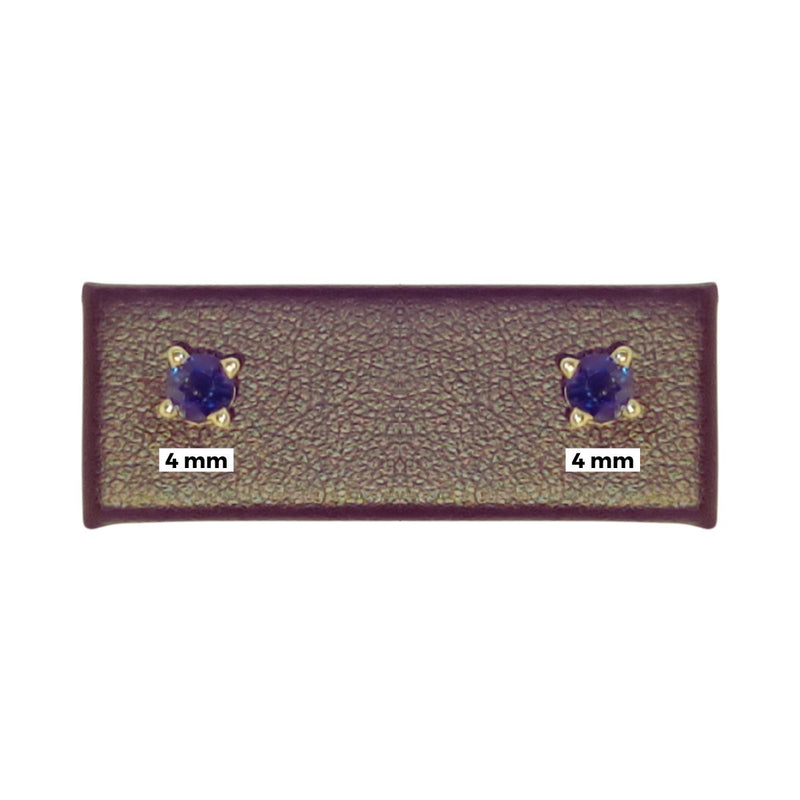 Elegant 4mm Natural Blue Sapphire Earrings in 14K Yellow Gold displayed with a 4mm tag beneath, emphasizing the gemstone’s size and beauty. Perfectly crafted, these earrings are ideal for everyday elegance. Available at Jewels of St Leon. Shop now.