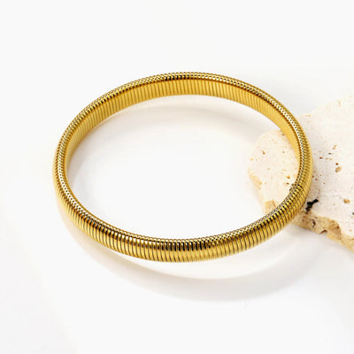 A sleek 8mm snake chain bracelet in polished 18K gold-plated stainless steel, offering a smooth and flexible fit.