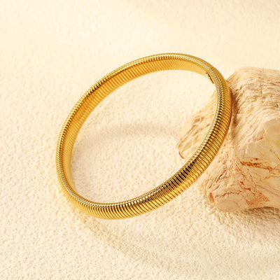 8mm Flexible Snake Bracelet, showcasing its seamless design and high-shine gold finish.