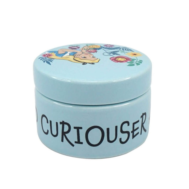 A rear view highlighting the seamless wraparound design of "Curiouser and Curiouser" against the ceramic surface in Alice&