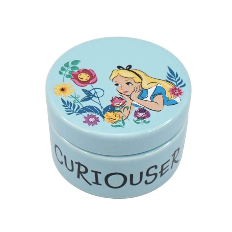 A high-angle shot capturing the detailed lid illustration of Alice with vibrant talking flowers and the overall charm of the round treasure box.