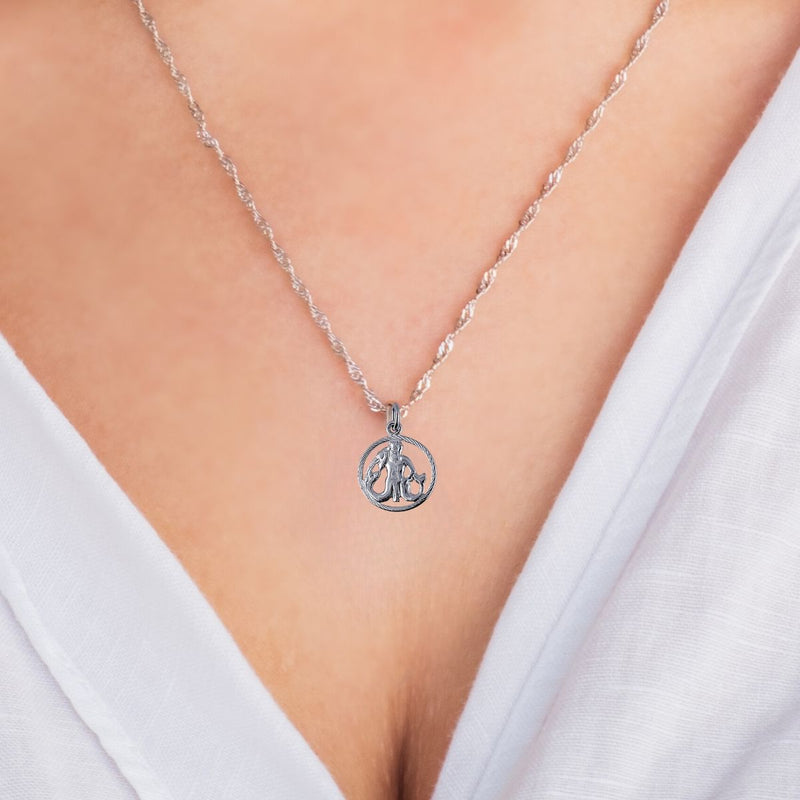 A model wearing the Aquarius Zodiac Charm Pendant on a sterling silver chain, showcasing the charm&