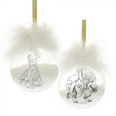 Close-up of Beast acrylic Christmas bauble with white feather detail and gold hanging ribbon.
