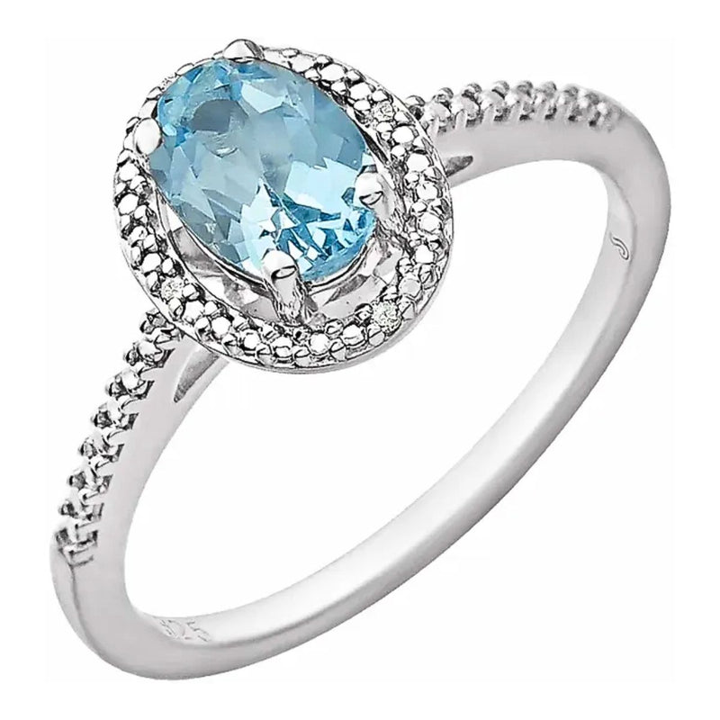 A top view of the Sky Blue Oval Topaz Beaded Halo Ring, showcasing the 7x5mm sky blue topaz and the surrounding beaded halo with sparkling diamond accents set in rhodium-plated sterling silver. Shop Ring for Women in Australia from Jewels of St Leon