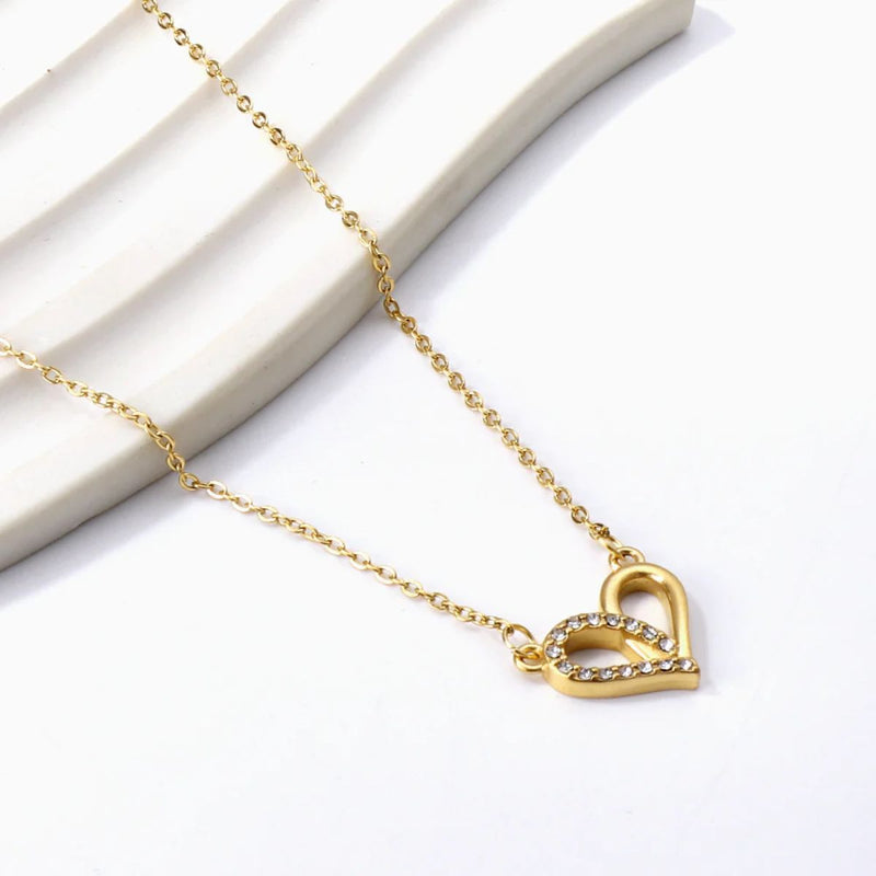 Heart Necklace displayed delicately on a soft background, highlighting the romantic shape and golden shine — perfect for gifting.