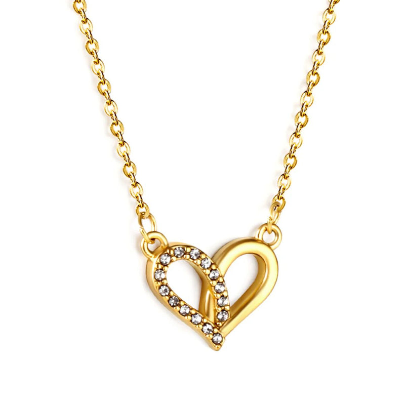 Close-up of the CZ Heart Necklace showing the fine contrast between polished gold and the shimmering CZ pave on one half of the heart.