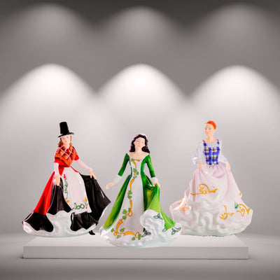 The Celtic Ladies Collection, featuring figurines from Ireland, Scotland, and Wales, honours Celtic traditions and national symbols like the shamrock. Handcrafted from fine bone china. Available from Jewels of St Leon.