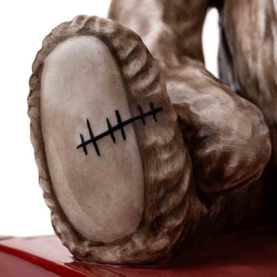 A detailed close-up of Jake's right foot, emphasizing the distinctive stitching detail that pays homage to his original design. The texture and precision of the scar add a unique touch to the figurine.