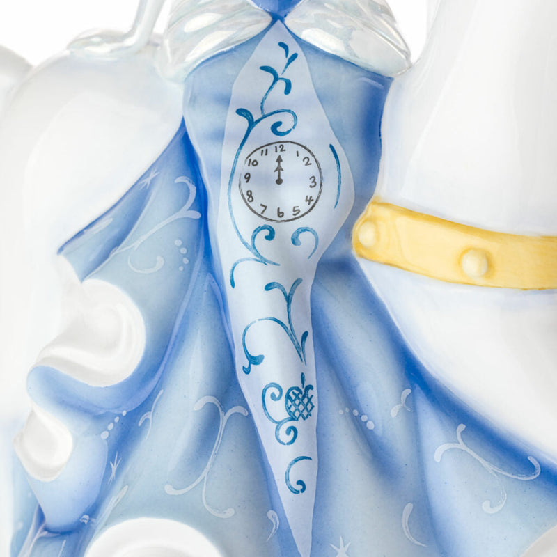 Detail of Cinderella’s gown with painted clock design, fine bone china Disney figurine