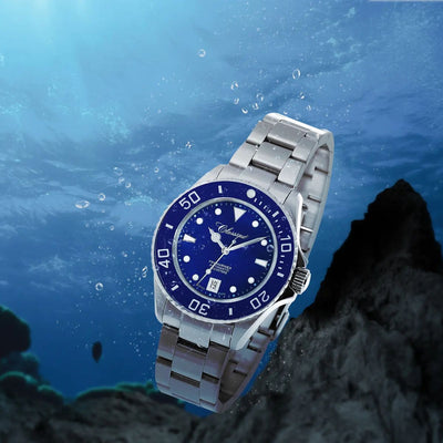 The Classique Pro-Mariner Blue Professional Divers Watch shown underwater, highlighting its 500m water resistance, luminous dial, and sapphire crystal. A Swiss-made automatic timepiece built for deep-sea performance.