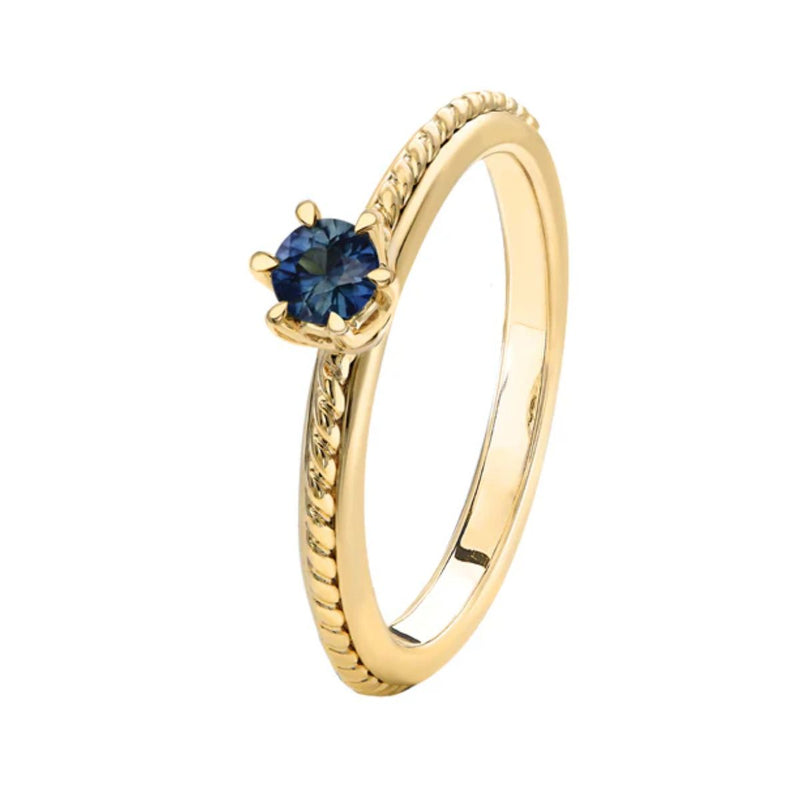 A stunning front view of the CLEO RING, showcasing the vibrant 3mm natural Australian teal sapphire set in a 9kt yellow gold band with an elegant rope edge design. Now Available from Jewels of St Leon.