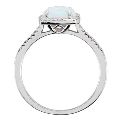 Front Side View of a created opal and diamond sterling silver halo-style ladies ring. Set with a 7mm lab-created opal and 0.01ctw natural diamond accents, this October birthstone ring is an ideal gift for someone special or a treat for yourself.