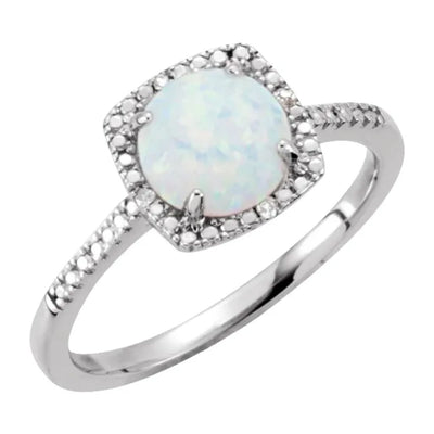 Top 45 degree view of a created opal and diamond sterling silver halo-style ladies ring. Set with a 7mm lab-created opal and 0.01ctw natural diamond accents, this October birthstone ring is an ideal gift for someone special or a treat for yourself.