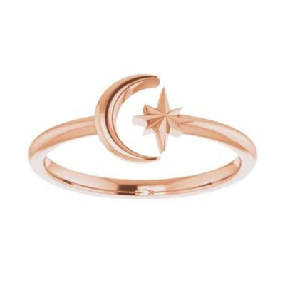 The Crescent Moon and Star Ring in 14K Rose Gold is a stunning example of the beauty that can be achieved through negative space. This ladies' gold ring is expertly crafted with intricate attention to detail, creating an elegant and unique fashion accessory. Shop at Jewels of St Leon.