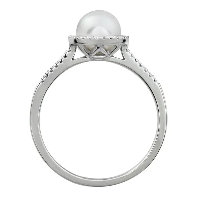 Side view Ladies Ring set with a 7mm Cultured Freshwater White Pearl and 0.01ctw Natural Diamonds, in a sterling silver halo-setting. Available from Jewels of St Leon