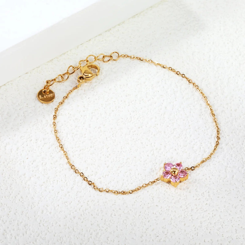 18K Gold Plated Stainless Steel Pink CZ Flower Charm Bracelet. This bracelet is waterproof, sweatproof, Hypoallergenic and durable.