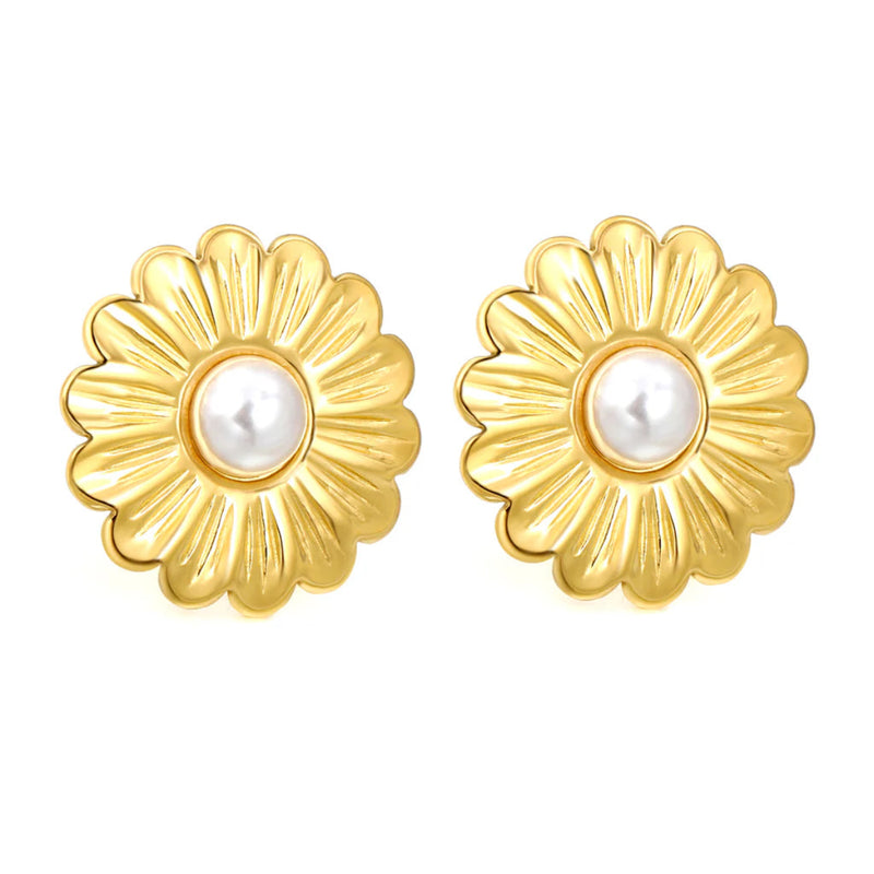 Front-facing shot of two 25 mm gold-plated daisy earrings with glossy white pearl centres against a clean white backdrop.