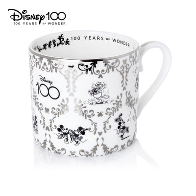 Disney 100 Cup and Saucer Set. This exquisite set features stunning imagery that celebrate 100 years of Disney magic. Handmade and hand decorated, this set is made from fine bone china and finished with real platinum decoration. Shop now at Jewels of St Leon.