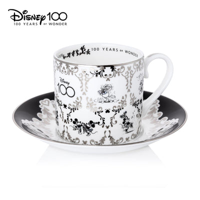 This Disney 100 Mickey and Minnie Mouse Cup and Saucer is a must for any Disney fan. The set is elegant and made of fine bone china with 100% platinum trim. The hand-decorated Mickey and Friends design adds a touch of wonder to your collection. Shop now at Jewels of St Leon.