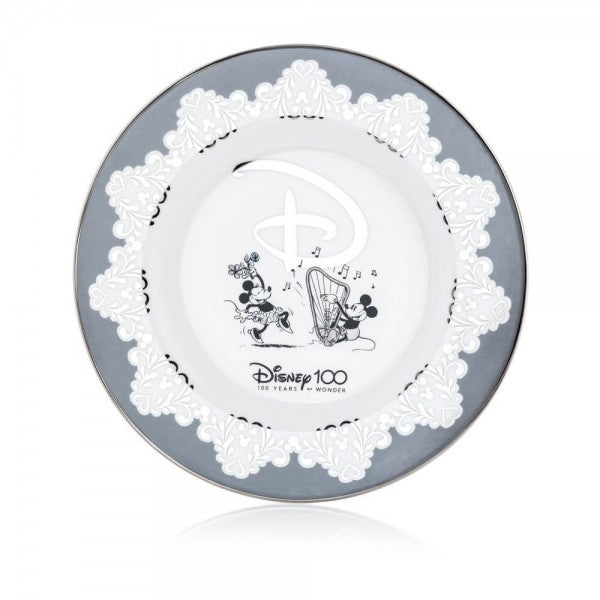 The Disney100 Mickey and Minnie Plate is made from fine bone china and decorated with real platinum detailing. The plate has beautiful old-school sketches of Mickey and Minnie in the centre. The Disney100 Mickey and Minnie Collector&