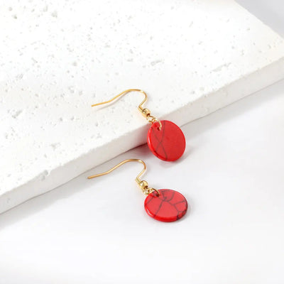 A detailed shot of the Red Jasper Style Earrings, highlighting their deep red finish and gold-plated stainless steel setting for a bold yet sophisticated look.