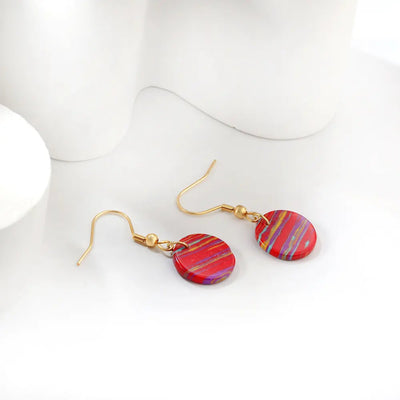 Multi-Colour Marble Earrings styled on a textured background, showcasing their playful, artistic vibe and high-fashion appeal.