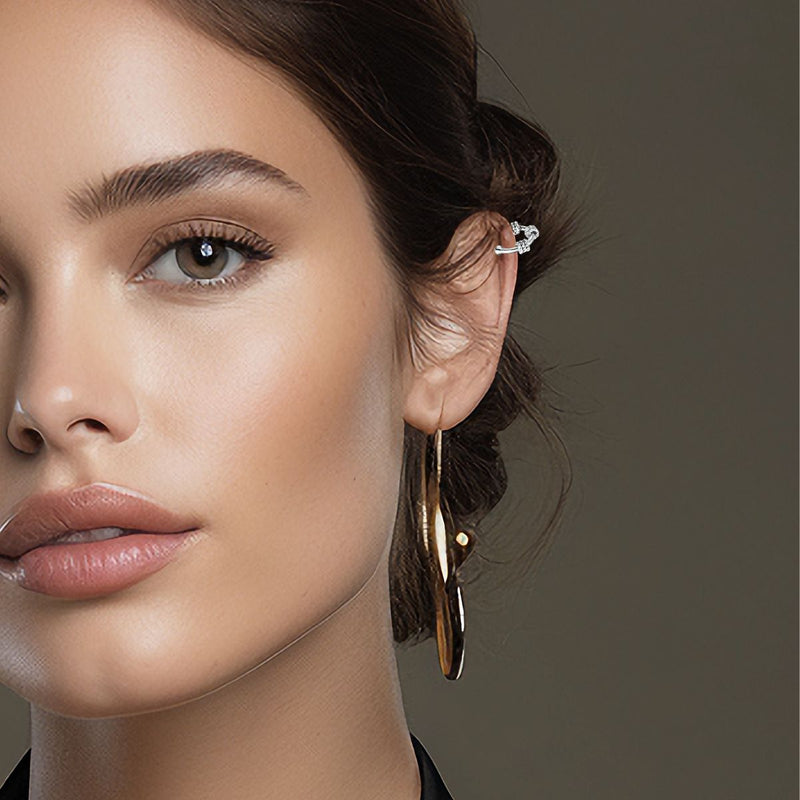 A model elegantly wears the 11mm Roped Earring Cuffs, showcasing their versatile design. The delicate rope pattern adds subtle detail, perfect for complementing any outfit with a touch of sophistication.