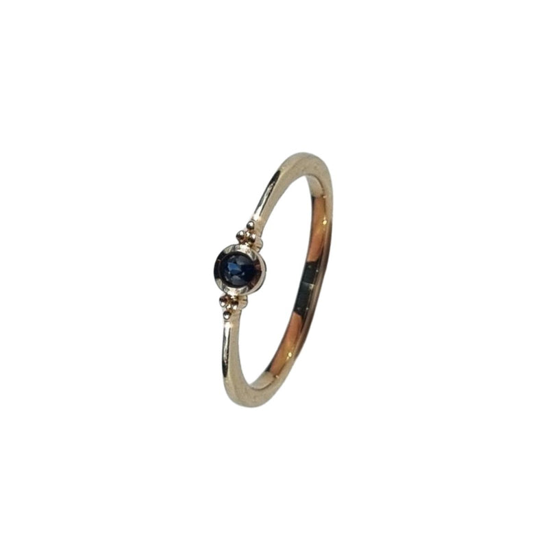 A forward-facing view of the ELLIN Ring, highlighting the stunning 3.75mm natural Australian blue sapphire set in elegant 9kt yellow gold. The solitaire design beautifully showcases the sapphire&
