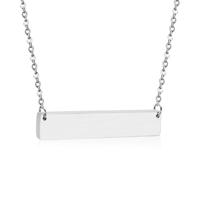 A beautifully draped engravable bar necklace, capturing its sleek design, sturdy chain, and modern minimalist appeal for men and women.