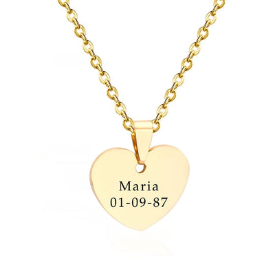 A romantic close-up of the Engravable Heart Necklace in 18K Gold-Plated Stainless Steel, beautifully inscribed with a name - an unforgettable symbol of love.