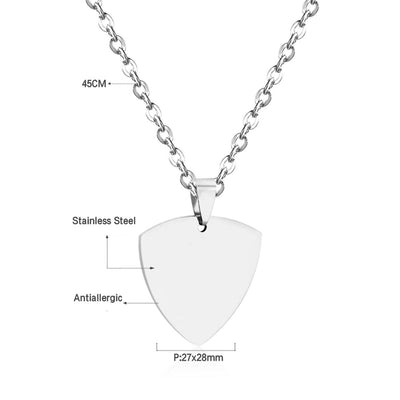 The sleek shield pendant resting on a soft background, highlighting its 27x28mm size, anti-allergic stainless steel build, and modern 45cm (18in) cable chain.