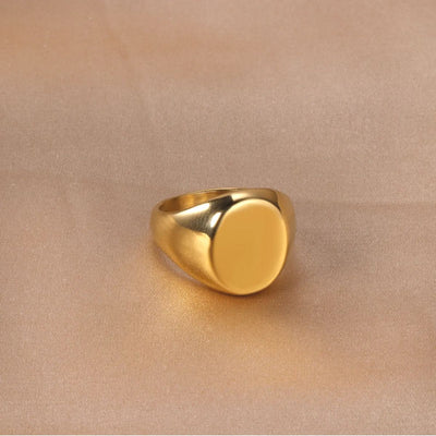 The perfect blend of elegance and durability, our Gold-Plated Signet Ring rests on a soft background, emphasising its timeless design. Waterproof and hypoallergenic, this personalised piece makes an unforgettable gift or statement accessory.