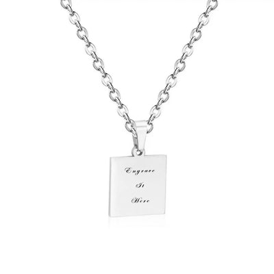 The Square Engravable Necklace, beautifully displayed on a jewellery stand, showcasing its sleek design, engraving area, and versatile styling options.