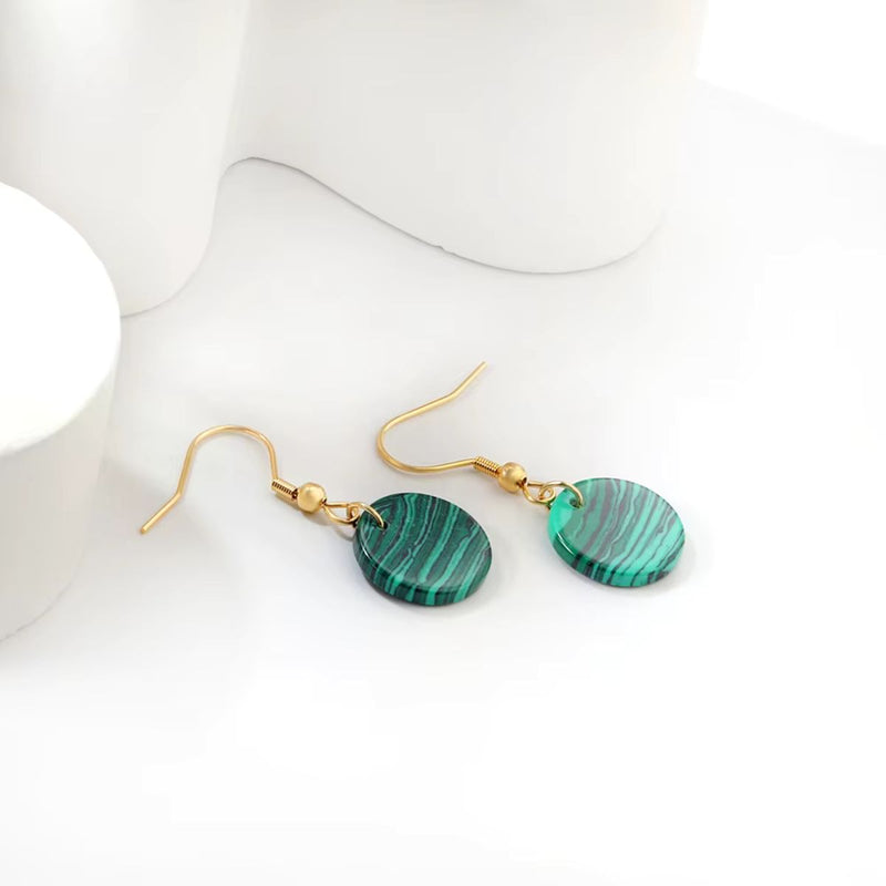 The Malachite Style Earrings beautifully displayed against a neutral background, highlighting their unique texture and luxurious gold accents.