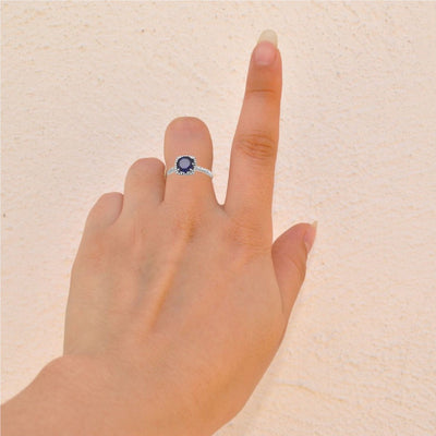 Model View - Discover elegance with our lab-created sapphire and 0.01CTW natural diamond silver ring. This stunning halo-style ladies ring is the perfect gift idea for any occasion. Shop now for a beautiful women's ring that combines sophistication and timeless beauty. Ideal for birthdays, anniversaries, and more.