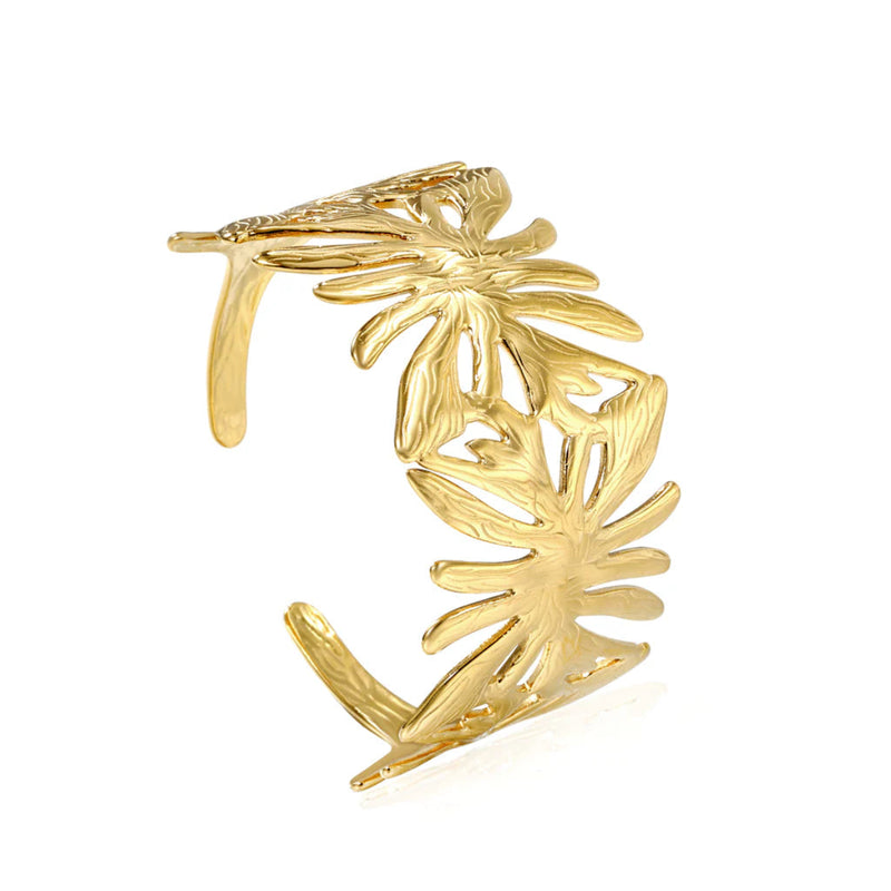 Close-up of the textured leaf pattern, showcasing intricate details and a comfortable, adjustable fit. This cuff bracelet is waterproof, tarnish proof with a hard 18K Gold Plating for a longer lasting shine and durability.